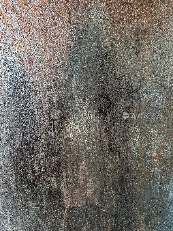 Full frame image of weathered, steel surface, rusty, grey metal sheet wallpaper background, focus on foreground